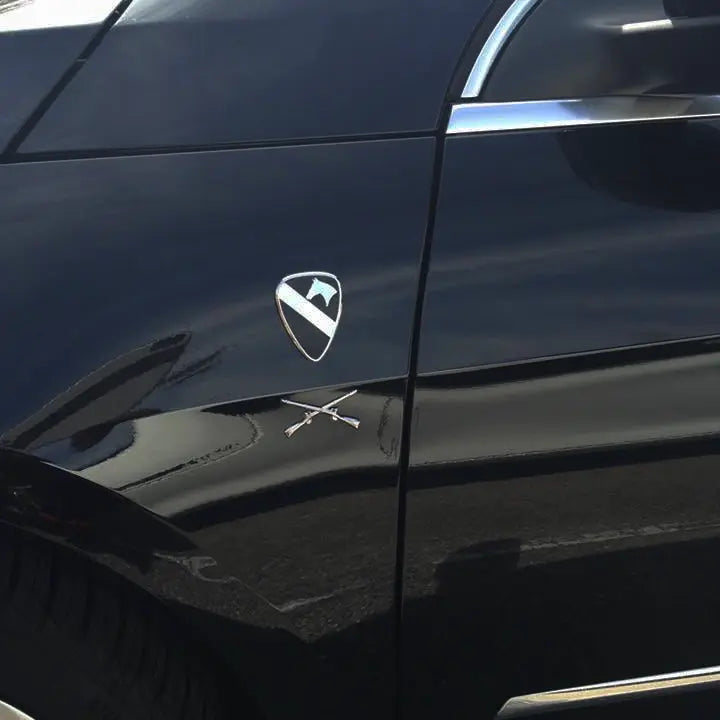 1st Cavalry Division Metal Auto Emblem in Black and Chrome on a black vehicle rear fender