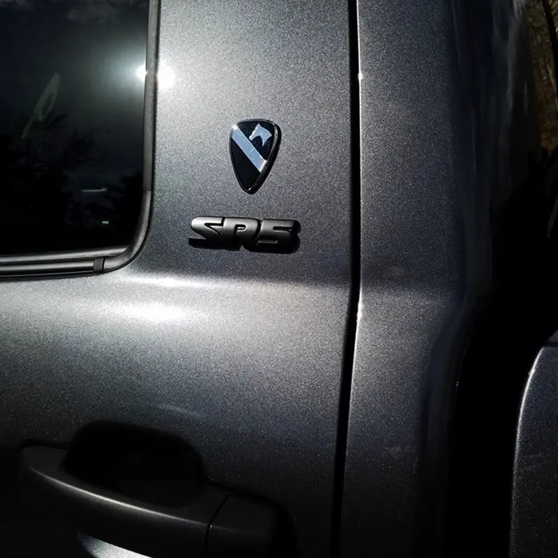 1st Cavalry Division Metal Auto Decal badge with a logo on a vehicle door