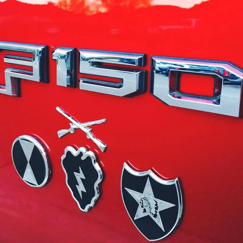 25th Infantry Division Metal Decal On Red Truck With Field Artillery Branch Insignia