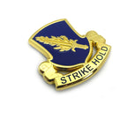 Decorative badge with blue shield and gold border on a white background
