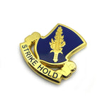 Gold and blue emblem with 'Strike Hold' text on a white background