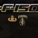 F150 logo with Airborne and Parachutist badge on a dark background