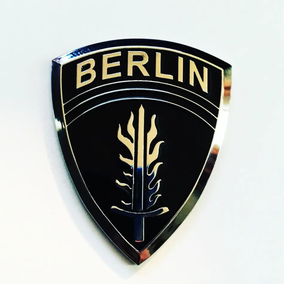 Black and Chrome Army Berlin Brigade Metal Decal on a White Background