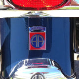 Close-up of a vehicle emblem with 'Airborne' and a logo on a shiny surface.