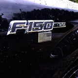 F150 logo on a car with an American flag detail, on a dark background.