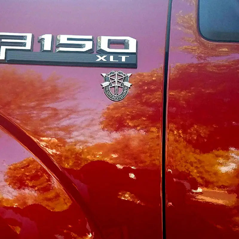 Special Forces Crest Metal Decal on Red Truck