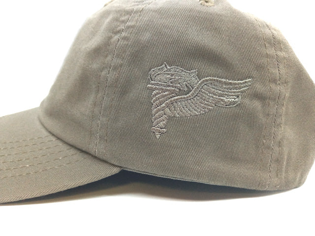A green and black embroidered 1st Aviation Brigade cap with an adjustable metal closure.