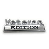 Veteran Edition Metal Decal on a White Background Sliver with Black Lettering