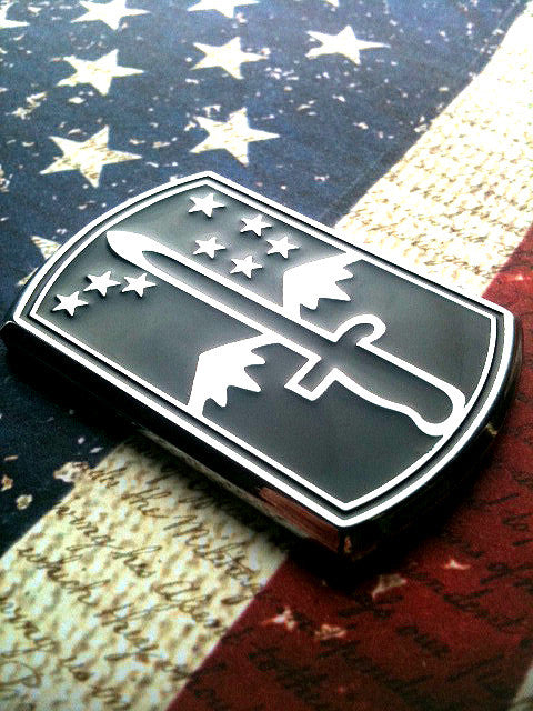 172nd Infantry Brigade Metal Car Emblem Facing the right on a red, white and blue background
