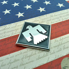 45th Infantry Division "Thunderbird" Metal Emblem on an American flag bakground with text