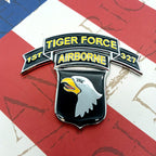 Tiger Force 1/327th Infantry Metal Decal with chrome plating, featuring the 'Tiger Force 1/327th Infantry' emblem with a chrome-plated eagle and text, on a background that looks like a flag.