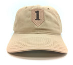 Beige cap with a brown patch featuring the number 1 on a white background