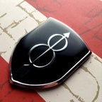 8th Infantry Division Metal Auto Emblem Pointing Left on a red and white background