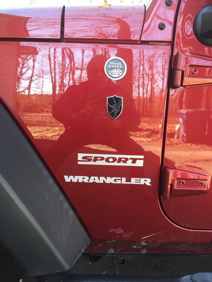 US Army Security Agency Metal Decal on a red Sport Wrangler Jeep Front Side Panel