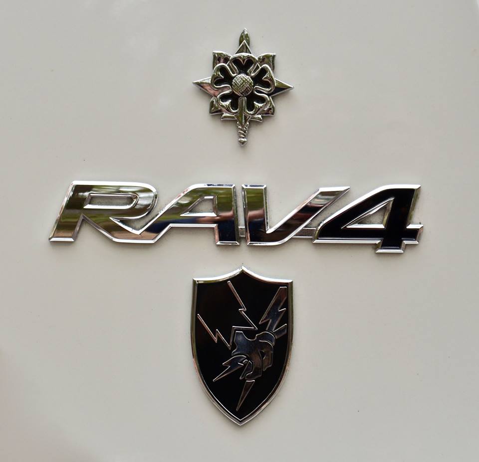 US Army Security Agency Metal Decal under RAV4 decal, on a white rear hatch door
