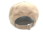 Backside of khaki hat with metal clasp