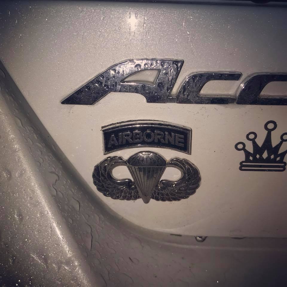 Airborne Tab and Jump Wings Metal Decals on a trunk of white car