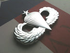 Chrome Senior Parachutist Badge Metal Decal Angled to the left on a Red, White, and Blue Background