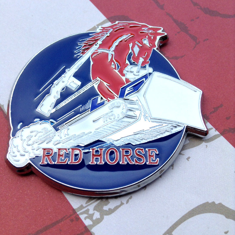 Decorative emblem with a red horse, rifle, and boot on a blue background, featuring the text 'Red Horse'.